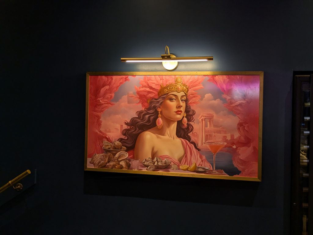 painting of Aphrodite that hangs on the wall