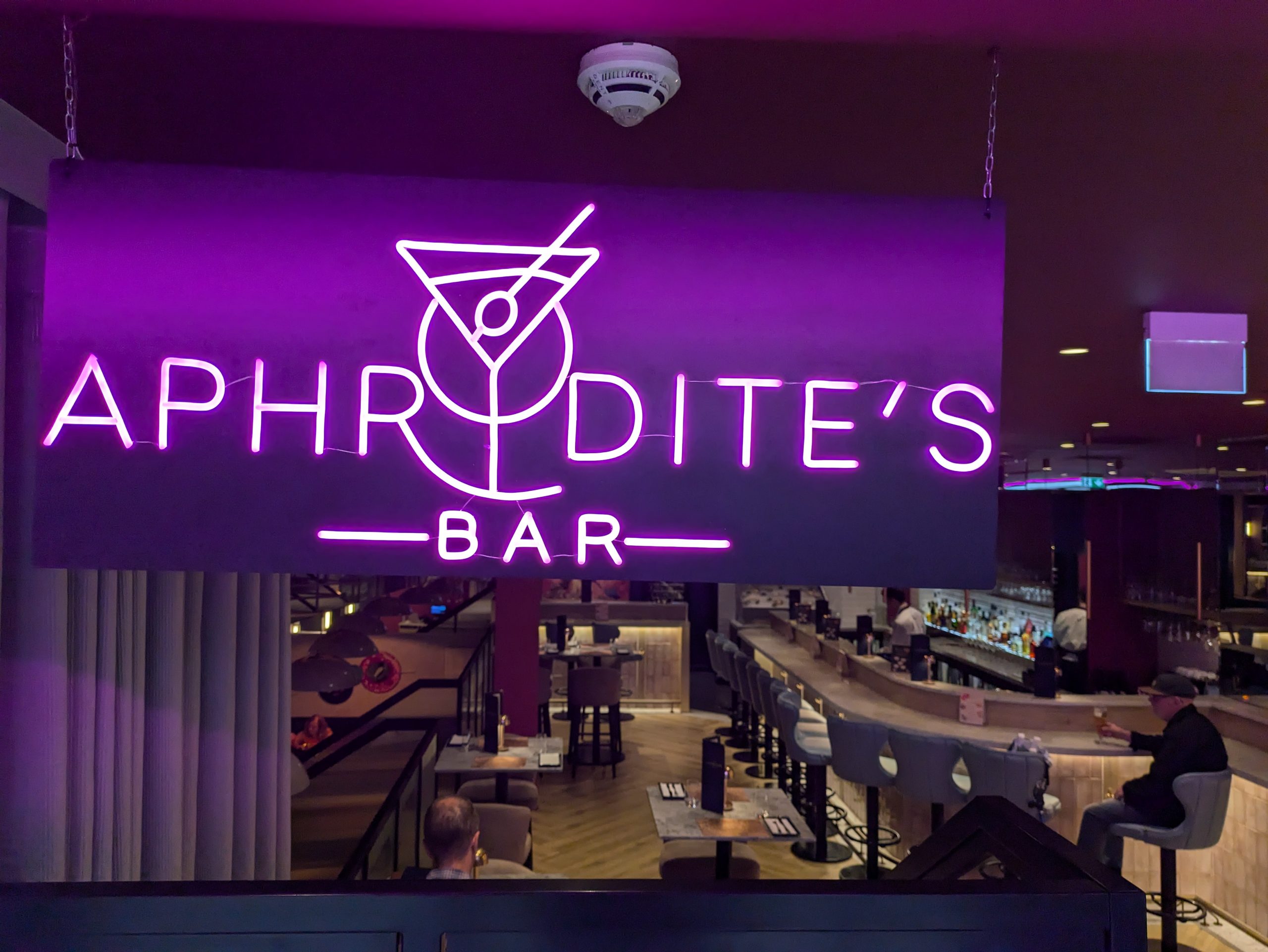 pink neon sign for bar