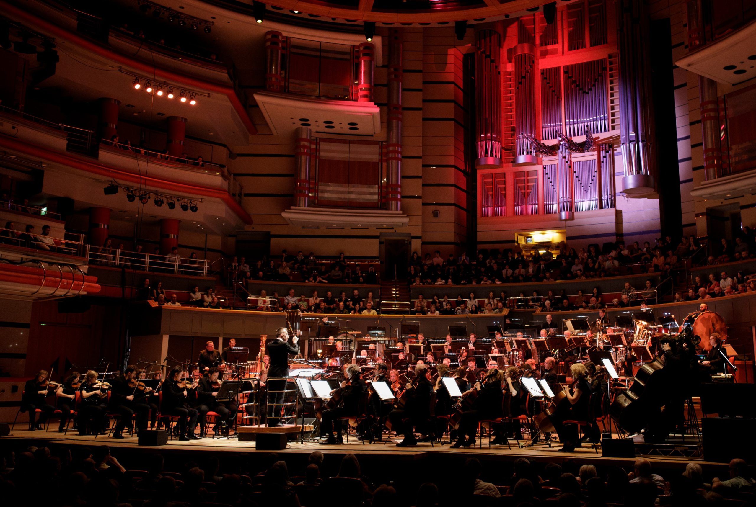 full orchestra playing on stage