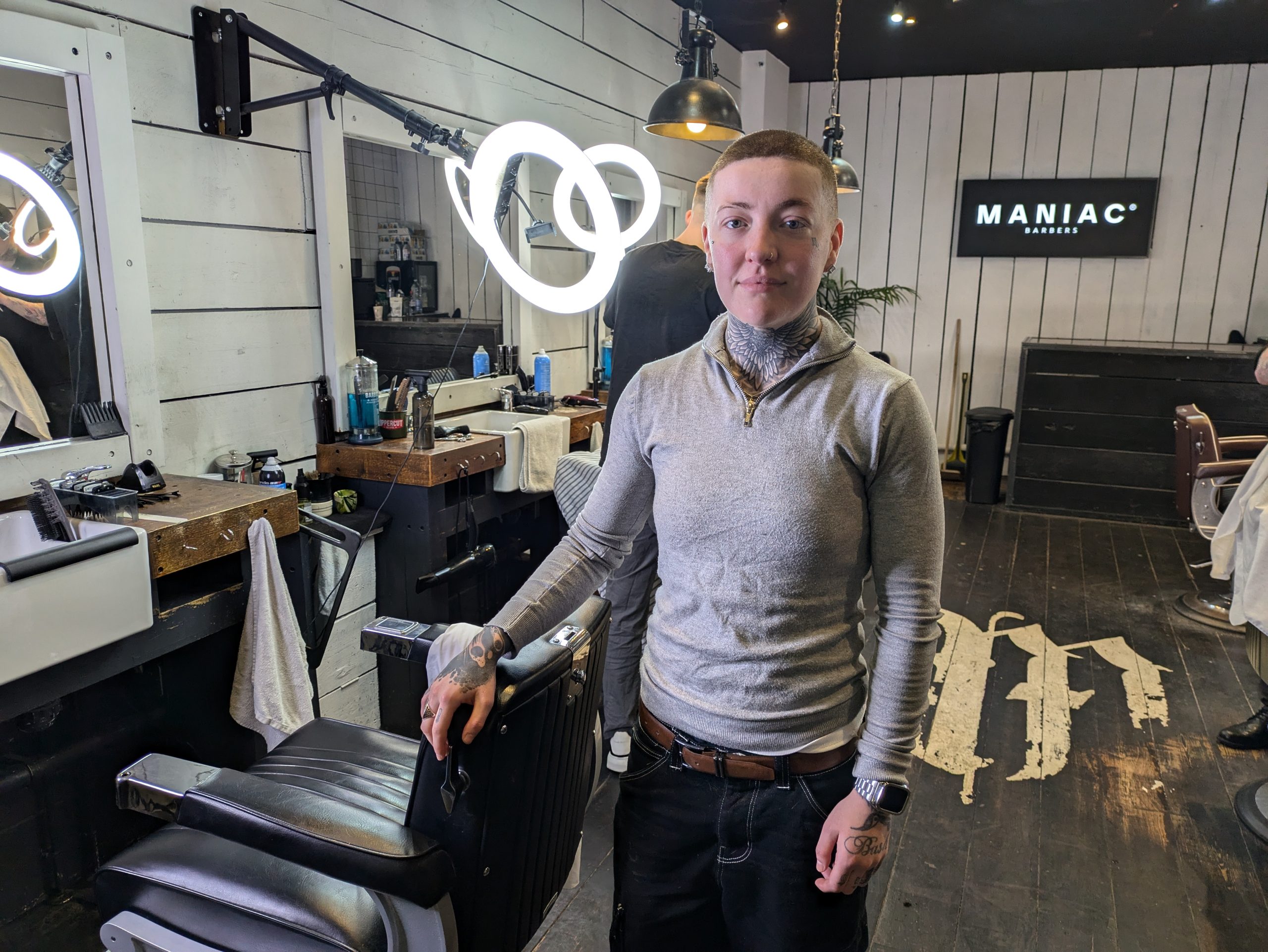 woman standing by barbers chair