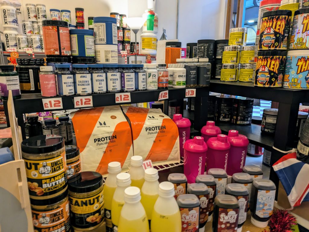 inside gym store with bottles of vitamins and nutrition